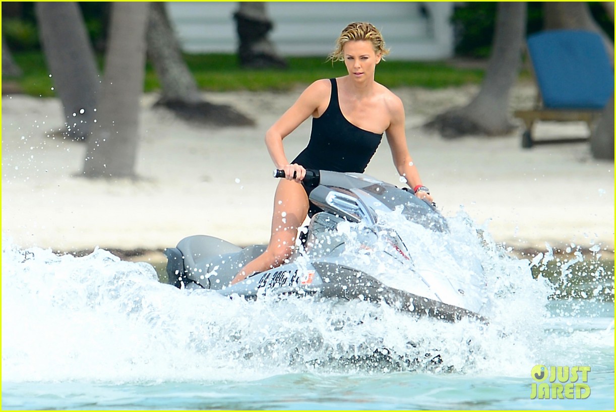 Full Sized Photo of charlize therons bathing suit body is so enviable during jet ski shoot 06