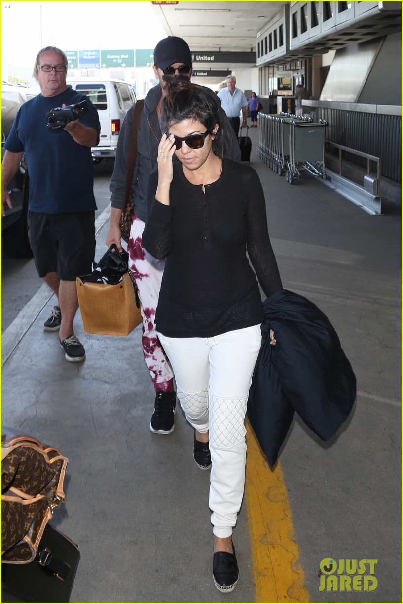 Khloe & Kourtney Kardashian Touch Down at LAX Just in Time for Mother's