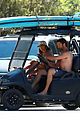 shirtless gerard butler goes surfing with woman 11