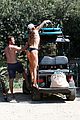 shirtless gerard butler goes surfing with woman 14