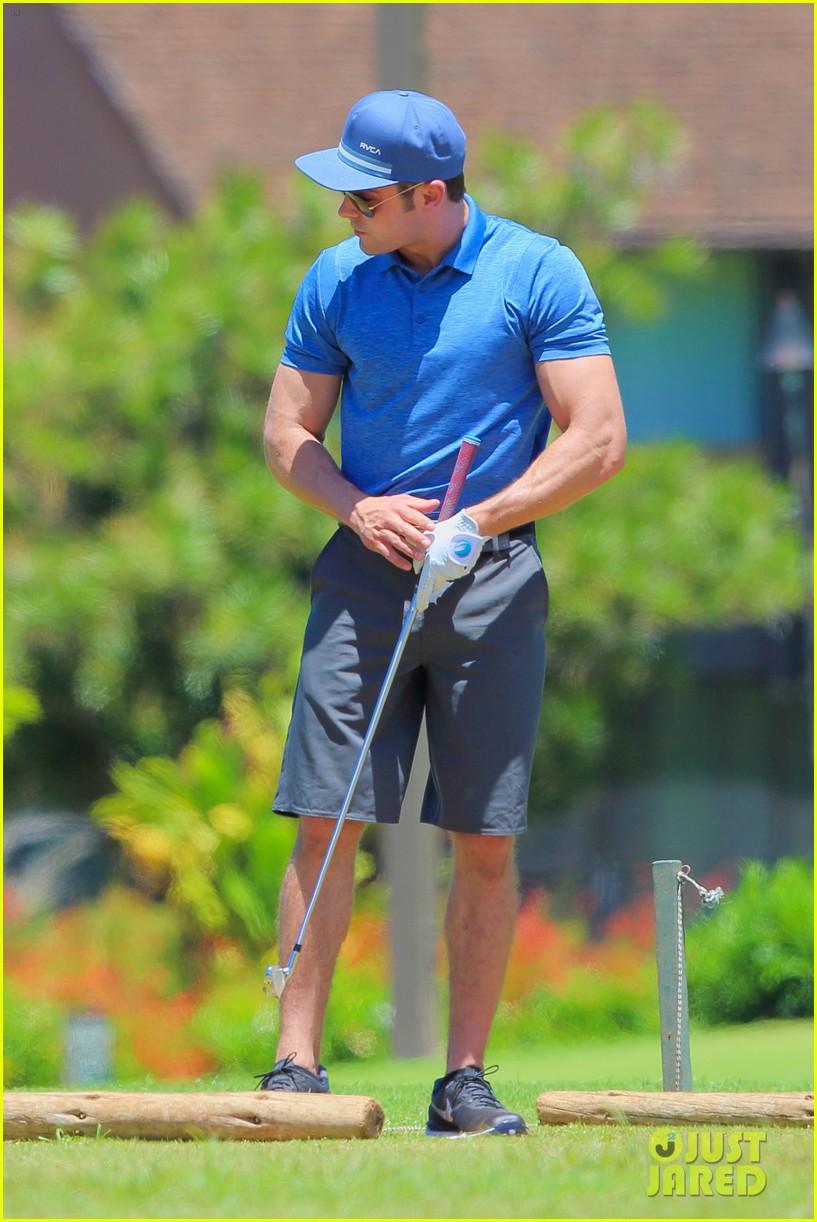 Zac Efron's Muscles Bulge Out of His Shirt While Playing Golf Photo