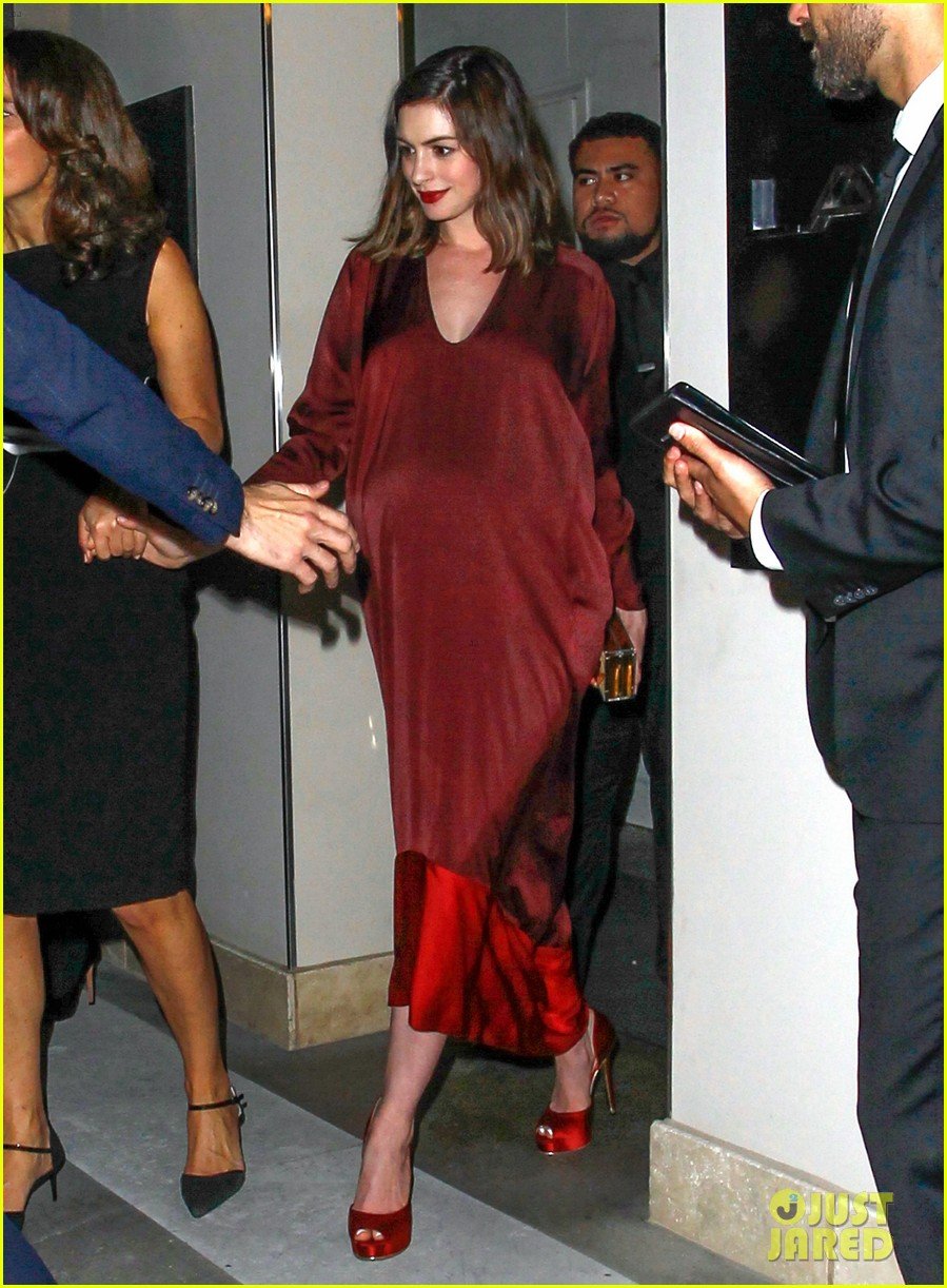Anne Hathaway covers figure in loose-fitting clothes amid 