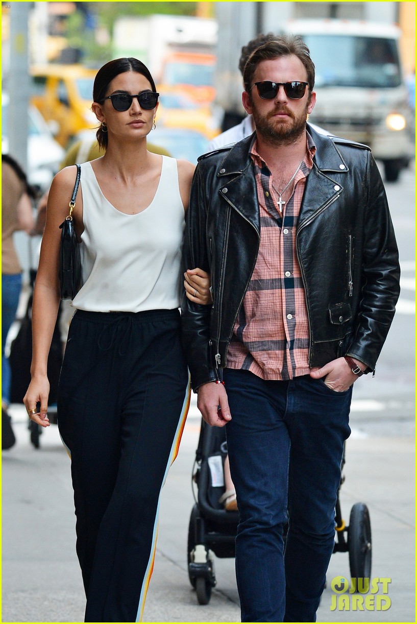 How should your arm be positioned when walking arminarm with a lady