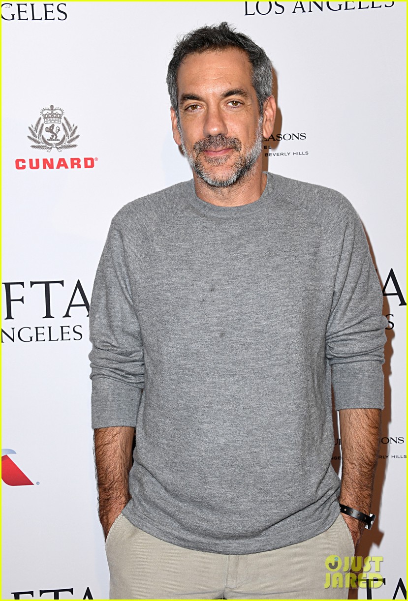 Isla Fisher & Sacha Baron Cohen Hold Hands While Arriving at BAFTA Tea