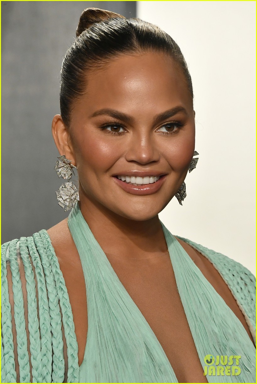 Chrissy Teigen's Steals The Spotlight In Her Blue Gown at Vanity Fair's