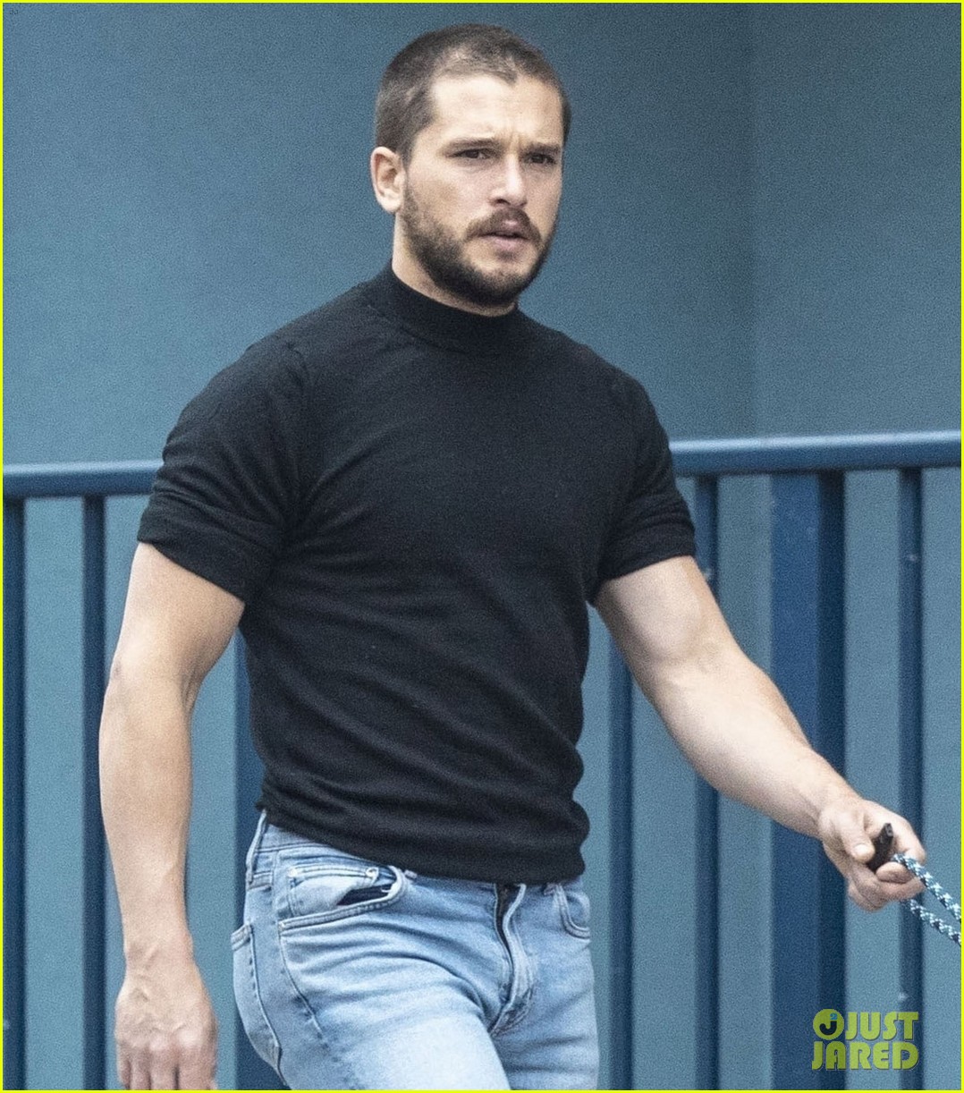 Kit Harington Debuts a New Buzz Cut During a Walk with His Dog Photo