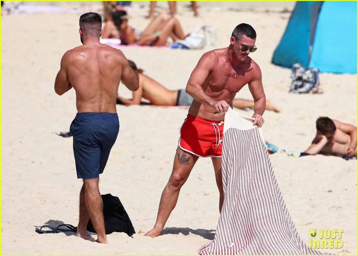 Luke Evans Shows Off New Leg Tattoo in Tiny Bathing Suit 
