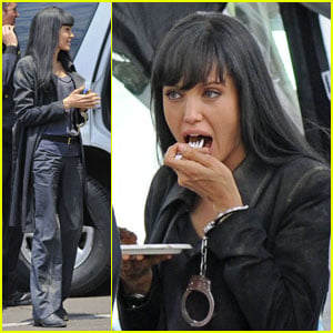 Angelina Jolie takes a break on the set of her new movie Salt to enjoy a