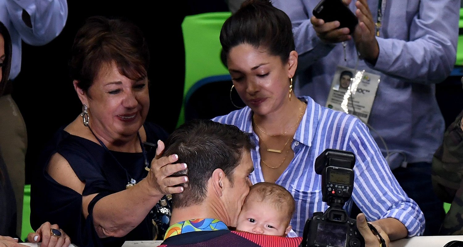 Michael Phelps Kisses Baby Boomer After Big Olympics Wins!
