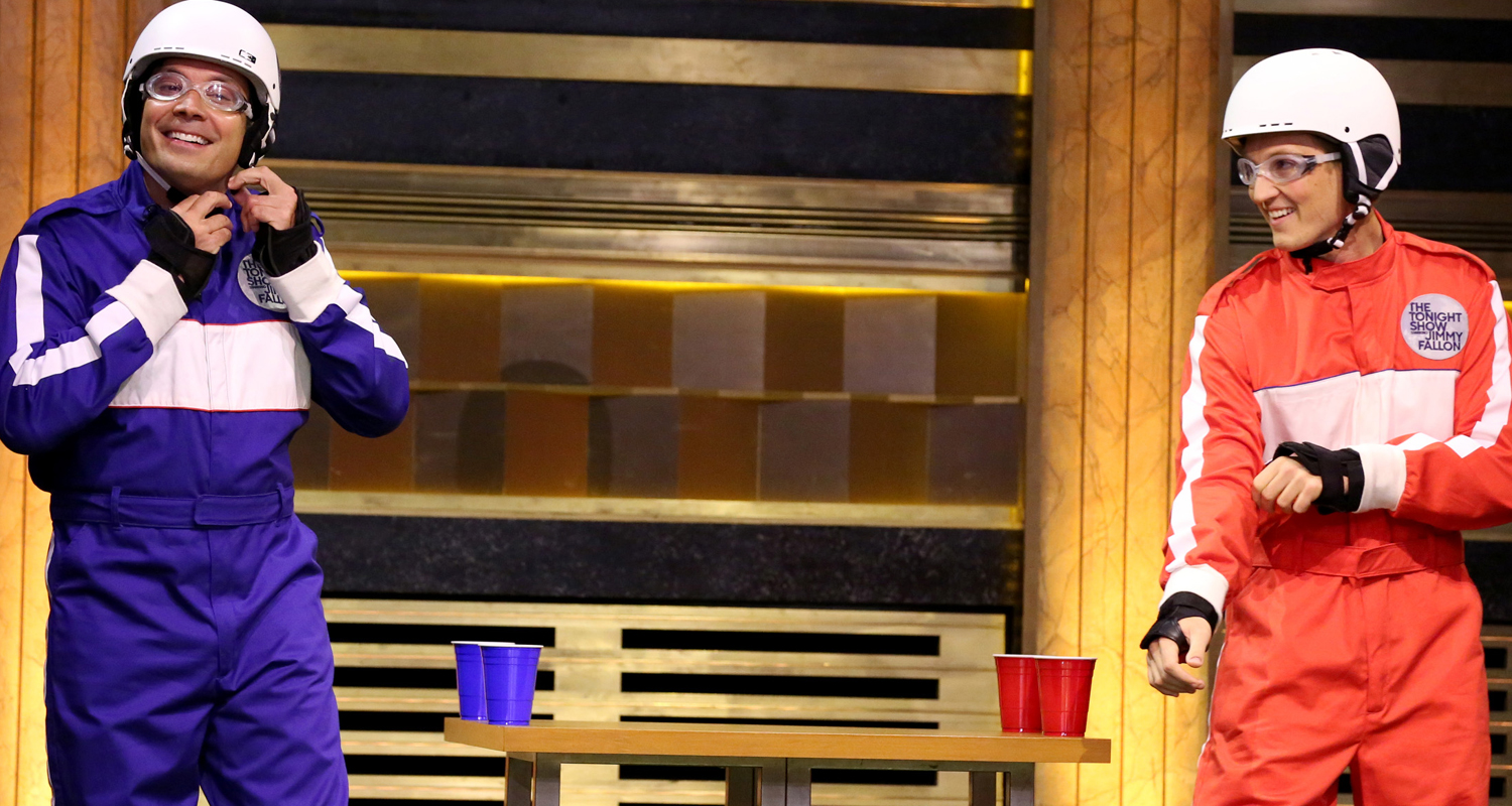 Miles Teller Plays SlipNSlide Flip Cup with Jimmy Fallon! (Video