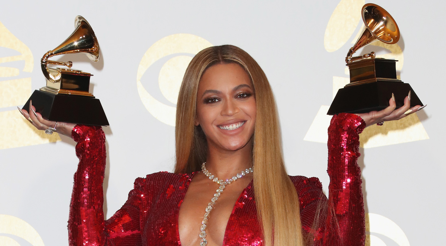 Beyonce Proudly Shows Off Her Two Grammys in Press Room!