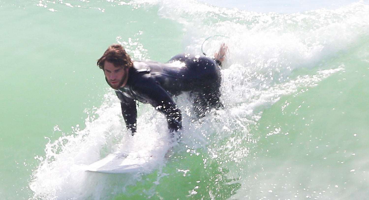 Liam Hemsworth's Wetsuit Shows Off His Totally Ripped Body