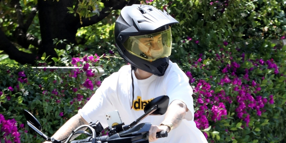 Justin Bieber Wears His Motorcycle Helmet To Pick Up Drinks After